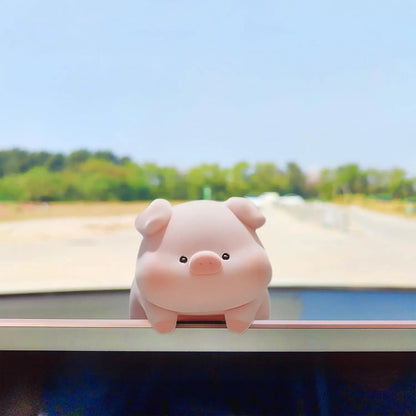 Mini desk ornament shaped like a lying piglet