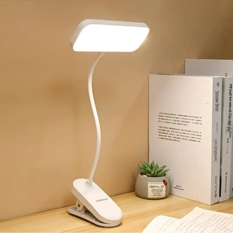USB-rechargeable LED desk lamp with a clip and touch controls, 3 brightness levels, and adjustable light, warm white