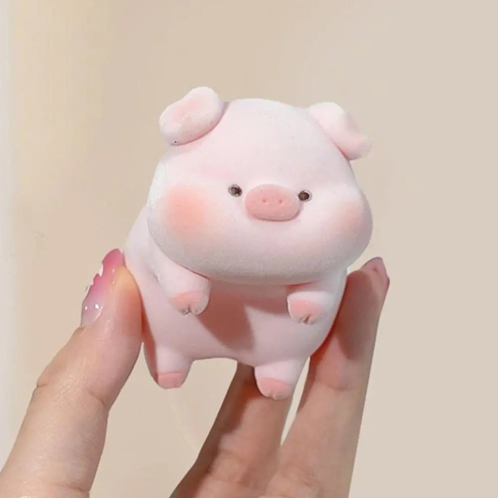 Mini desk ornament shaped like a lying piglet