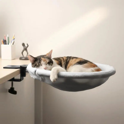 Hammock-style cat bed for a desk 