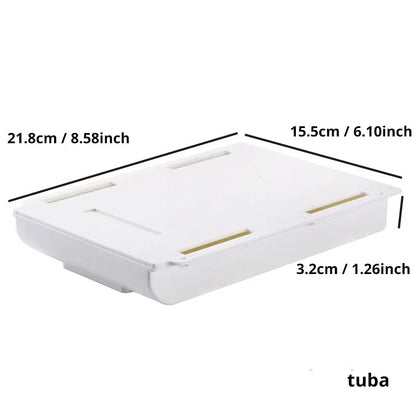 1 white self-adhesive storage box, a tray for makeup pencils and more, which tucks away under the desk