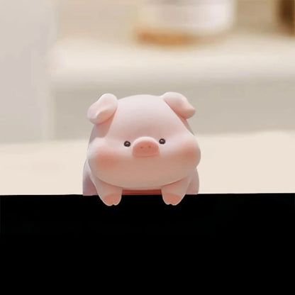 Mini desk ornament shaped like a lying piglet